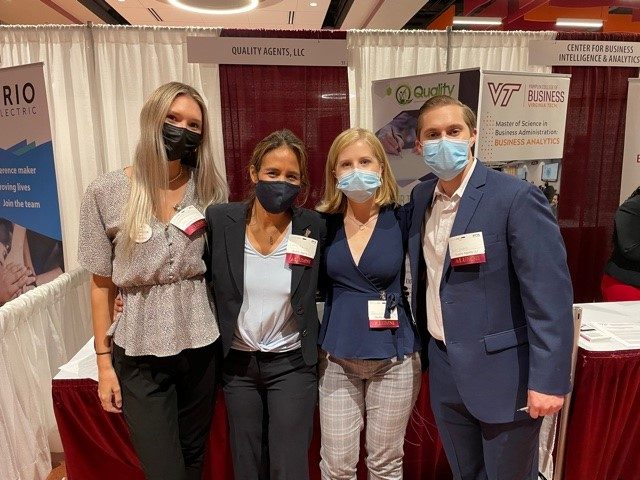 Quality Agents at the 2021 Virginia Tech Engineering Expo. Carla Rampy is standing alongside BSE Class of 2020 graduates Samantha Bond, Kevin D'Andrea, and Ally Young, who all have joined Quality Agents post-graduation.