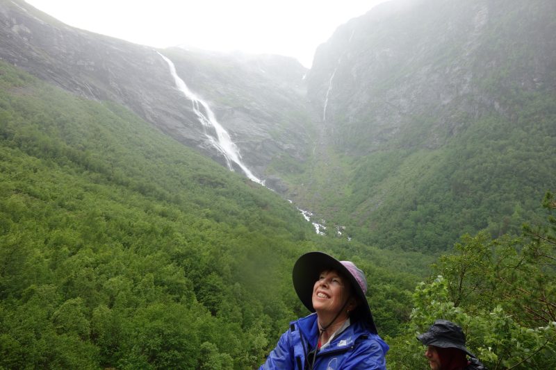 Mary Leigh Wolfe stands in front of waterfalls